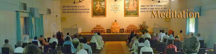 Swamiji and devotees sitting in meditation