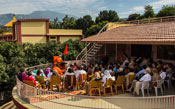 Swamiji and devotees sitting on the terrace during morning satsang
