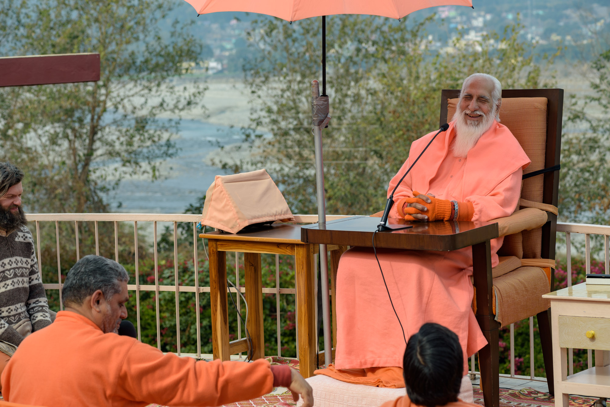 View of Swamiji during Satsang with Yamuna River in the background